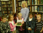 Patricia Gott reading to children at West Paris Library