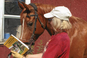 Author and her Arabian horse, Sani, reading her book Horse Tails by Famous Fred